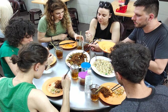 Amazing Local Food Tour in Kuala Lumpur - Chinatown by LRT or car: noodles, small stalls, and local transport rhythm