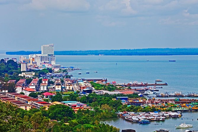 Full-Day Sepilok Orangutan and Sandakan City Trail from Kota Kinabalu - Sandakan city tour: temples, colonial corners, and the Central Market