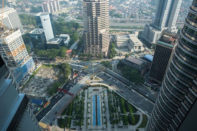 Petronas Twin Tower Skybridge View & Dining Experience Tour with Local Host - Snack, Tea, and 42nd-Floor Dining: What You Get and How to Choose
