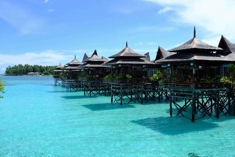 Semporna: Mabul and Kapalai Trip in Snorkel or Dive & Lunch - Mabul Water Bungalows: walking the water village vibe and grabbing photos
